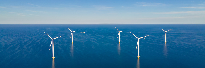 Windmill park in the ocean, drone aerial view of windmill turbines Wind Turbines Windmill Energy Farm