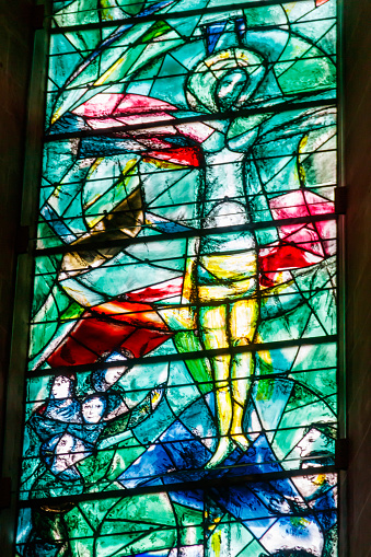 Zurich, Switzerland  - April 19, 2022: Stained glass window of the Protestant church Fraumunster designed by Marc Chagall in Zurich, Switzerland