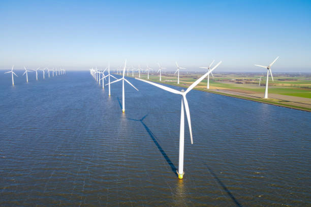 istock Offshore Wind Turbines Farm At sunset 2078318057