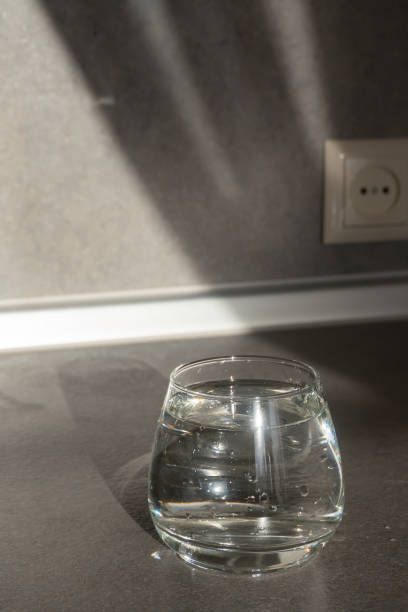 a glass of clean water stands on the table