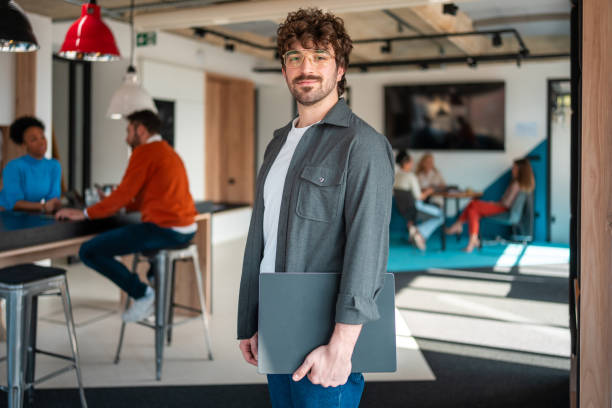 istock Confident Young Male Entrepreneur at a Modern Coworking Space 2078320376