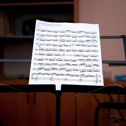 Sheet music on the music stand in room