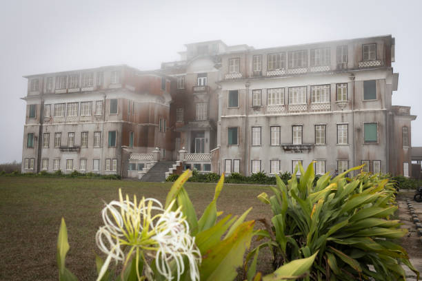 Bokor Palace Hotel Bokor Hill Station, Kampot, Cambodia on Feb 21, 2024: The hill station was built as a resort by colonial French to help the French military who were stationed in that region. They were desperate for some relief from the oppressive heat that is characteristic to this part of the world. So in the early 1920's, Bokor Hill, a small resort town was built especially for the occupying French soldiers. Nine hundred people died in nine months during the construction of the resort in this remote mountain location. The centrepiece of the resort was the grand Bokor Palace Hotel, inaugurated in 1925. It is also an important cultural site, showing how the colonial settlers spent their free time. kampot stock pictures, royalty-free photos & images