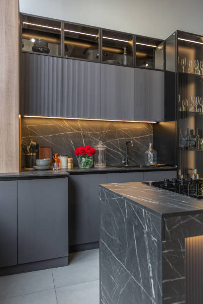 istock wood decorated dark kitchen area with coocking island in huge modern spacious apartment with high loft style ceilings, wooden decoration and grey walls 2078337771