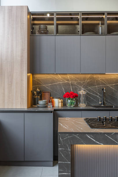 istock wood decorated dark kitchen area with coocking island in huge modern spacious apartment with high loft style ceilings, wooden decoration and grey walls 2078337773