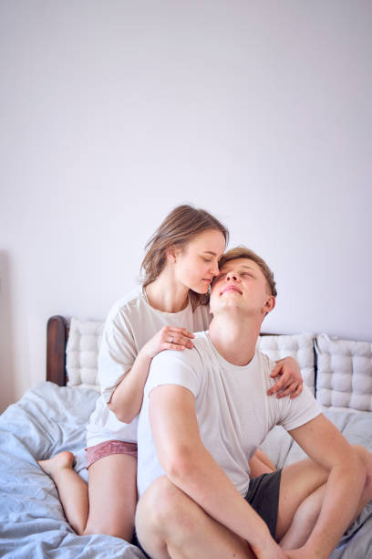 istock young couple on the bed, very tender hugs 2078343591