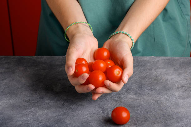 Free Stock Photo of A hand holding a pile of tomatoes | Download Free ...