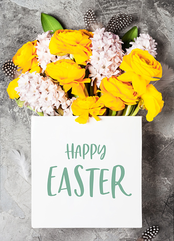 Beautiful spring flowers and Easter decorations. Happy Easter greeting card