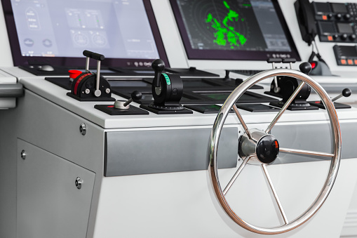 Marine navigation simulation system, ship control panel with steering wheel and electronic  equipment af the captains bridge