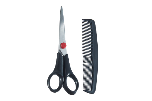 Scissors And Comb Over White Background