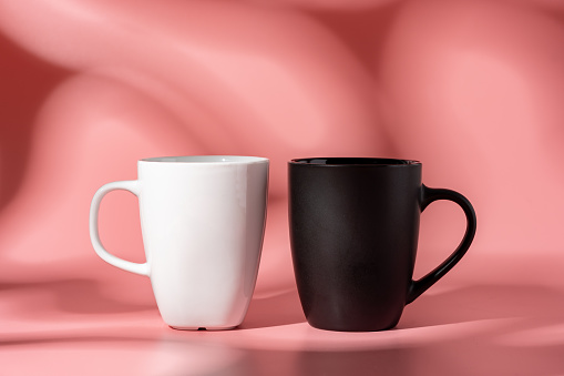 Ceramic mug mock up on pink background studio shot close up
