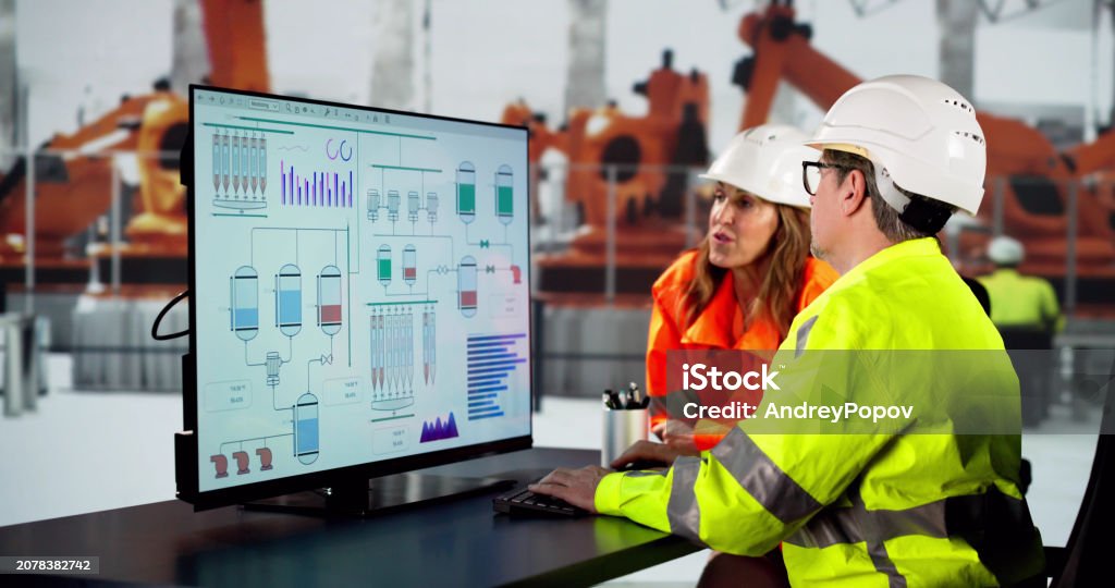 Engineer Using Computer Stock Photo - Download Image Now - 50-54 Years ...