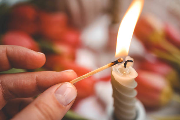 Girl lights a candle, spring aesthetics.