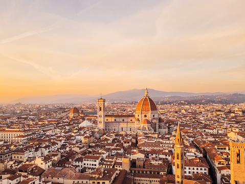Aerial view of Florence's skyline at sunset. Santa Maria del Fiore and other famous buildings in Florence, Tuscany, Italy.