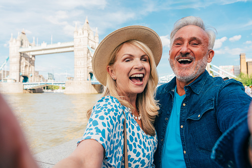 Happy senior couple spending time together in London city. Concepts about seniority, lifestyle and travel