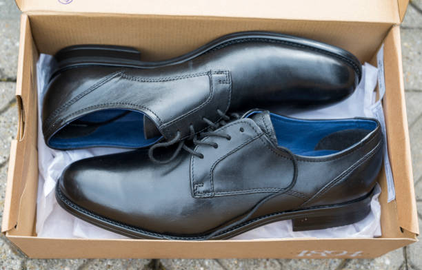 istock New black leather shoes in a paper box 2078446604
