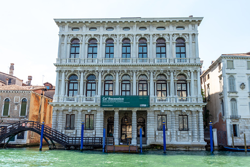 Venice, Veneto - Italy - 06-10-2021: The grand Ca' Rezzonico museum fronts the Grand Canal, showcasing Venetian baroque architecture