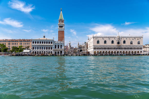 Venice, Veneto - Italy - 06-10-2021: Iconic view of St. Mark's Campanile and Doge's Palace along the Grand Canal