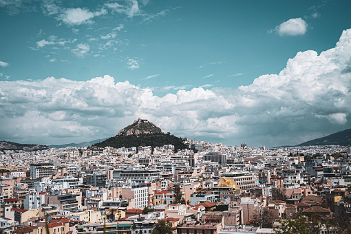 City view of Athens, skyline with mountain, cloudy sky