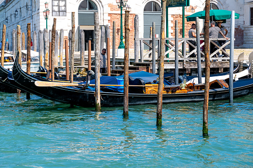 Venice, Italy - Jun 29, 2020: Rialto bridge and Grand Canal in Venice. Architecture and landmarks of Venice. Venice postcard with gondolas