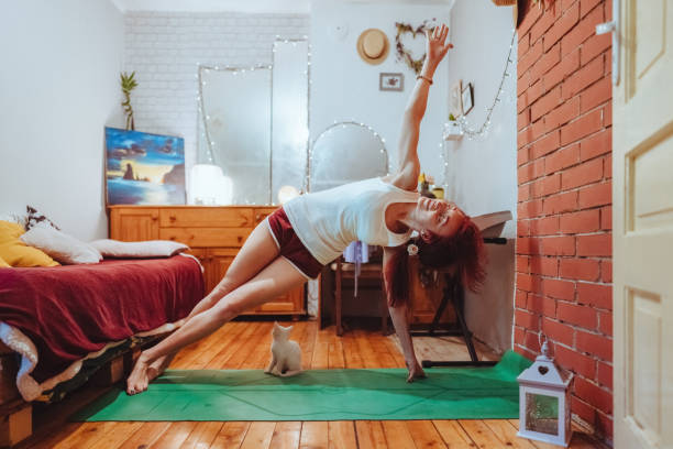istock Student practices yoga at home 2078472834