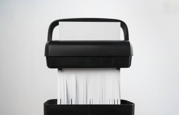 istock Black paper shredder cutting paper on gray background 2078473968
