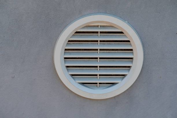 istock White plastic circular ventilation grill in a gray wall. 2078476240