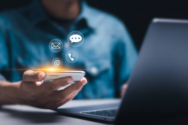 istock Contact us concept. Businessman using smartphone with virtual contact us icon or Customer support hotline people connect. 2078494556