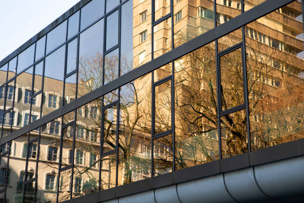 Modern office building at Square de Meeûs - a small city park in Brussels