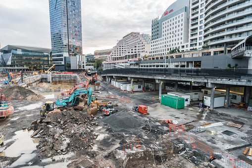 Sydney, NSW, Australia, February 19th 2024. Construction site in urban area, with excavation in progress. There are multiple vehicles around the site.