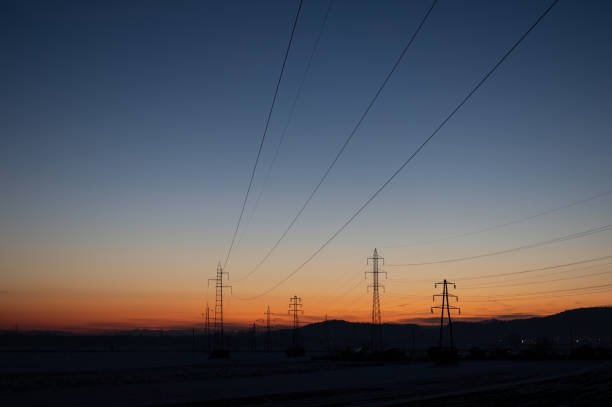 istock Power lines in night landscape with sunset. 2078498173