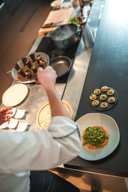 istock Creative and Dedicated Chef Preparing Gourmet Fare for Bachelorette Event 2078503280