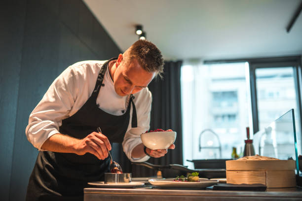 istock Creative and Dedicated Chef Preparing Gourmet Fare for Bachelorette Event 2078503452