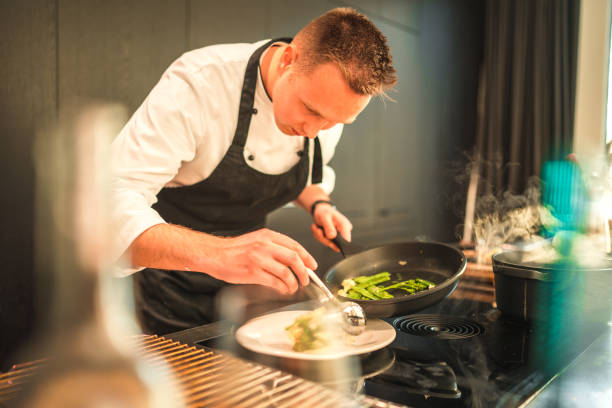istock Caucasian Personal Chef Preparing Food in the Modern Kitchen 2078504028