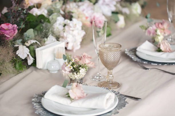 istock Delicate wedding table setting. A plate with a napkin and a rose. 2078523866