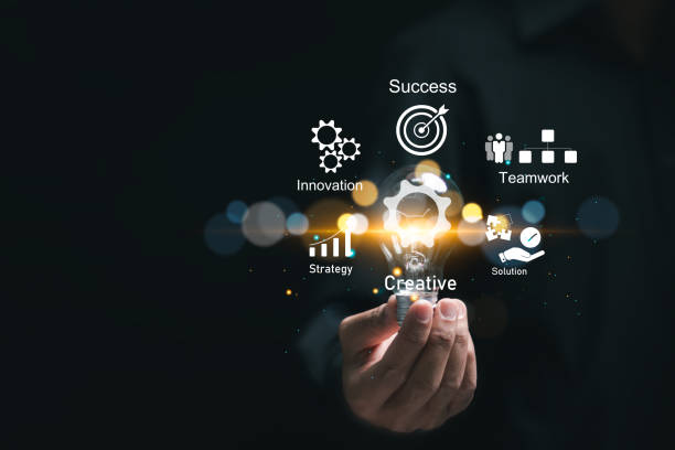 istock Businessman holding light bulb with virtual business strategy icons for effective work planning leads to business success. Business development concept. 2078528071