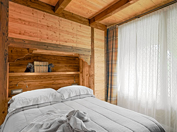 istock rustic bedroom interior with wooden wanscoting, 2078529117