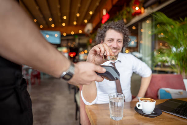 istock Businessman paying with credit card 2078530159