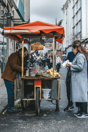 Istanbul, Turkey-February,22: The man selling roasted corn in Eminonu
