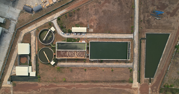 Aerial View of Waste Water Treatment plant in Industrial estate, business and industrial concept ,Equalization and Aeration pond