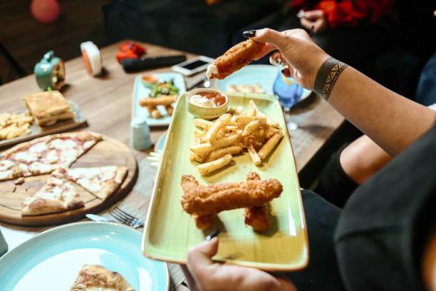 istock Person Holding Plate With Food 2078615257