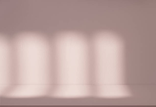 istock Beige Concrete texture wall background with light,leavs shadow,Empty Studio Cement room with Sunlight reflect on peach colour paint, Backdrop for Spring,Summer product design presentation 2078651846