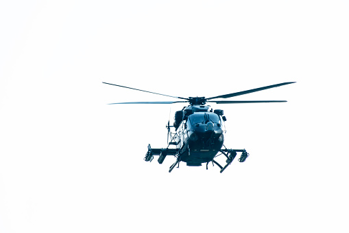 Helicopter is flying on isolated white background
