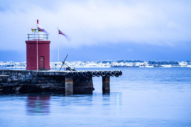 Small local lighthouse in Alesund port Scandinavia Norway Northern Europe
