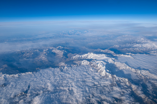 Aerial view of European Alps in spring. Snow still present on the Glaciers