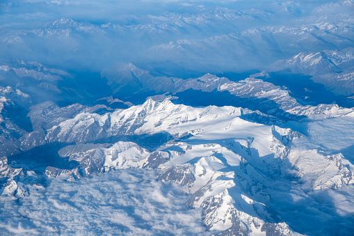 Aerial view of European Alps in spring. Snow still present on the Glaciers