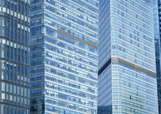 close up on modern office building with blue glass windows