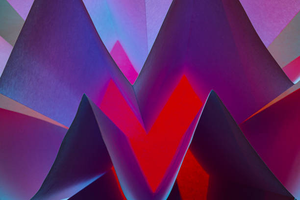 Background with abstract geometric shapes made with folded and illuminated paper