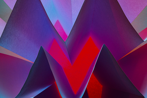 Background with abstract geometric shapes made with folded and illuminated paper