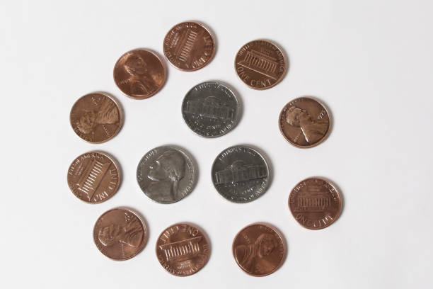 A pile of various American coins isolated on white background